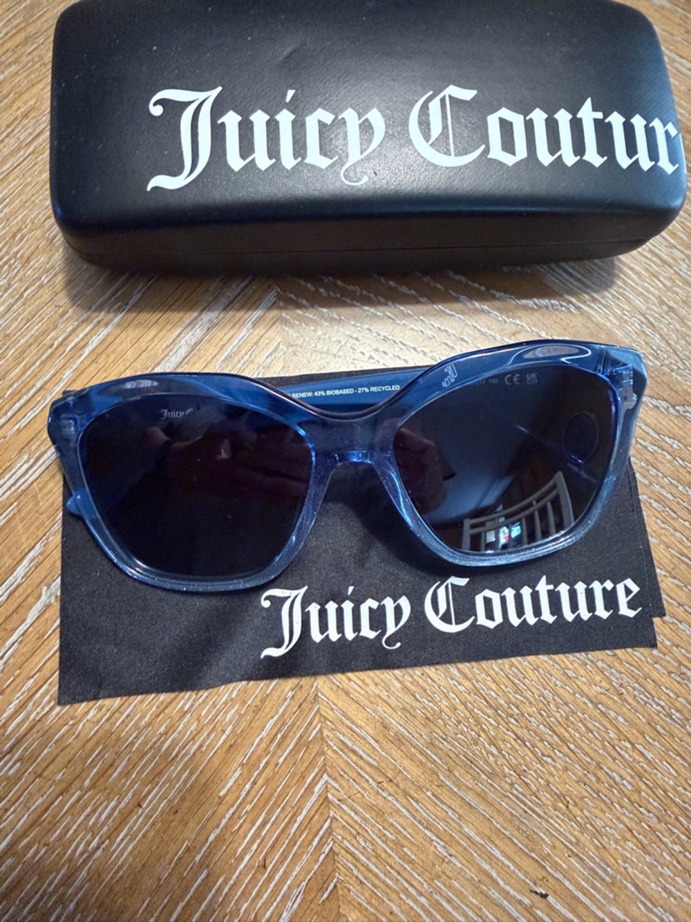 Juicy Couture Clear Blue Frame Sunglasses with Dark Lenses
